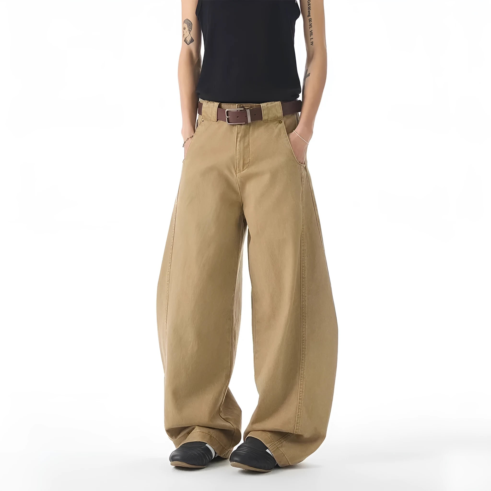 Brown men's loose-fit straight-leg jeans with a button fly on a mannequin.