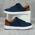Low-top platform skate shoes with cross-strap detail and mid-heel design in beige brown colour