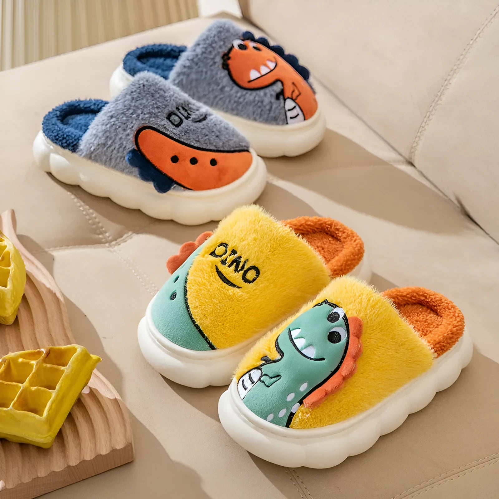 A pair of plush cotton dinosaur-themed couple slippers for indoor use.
