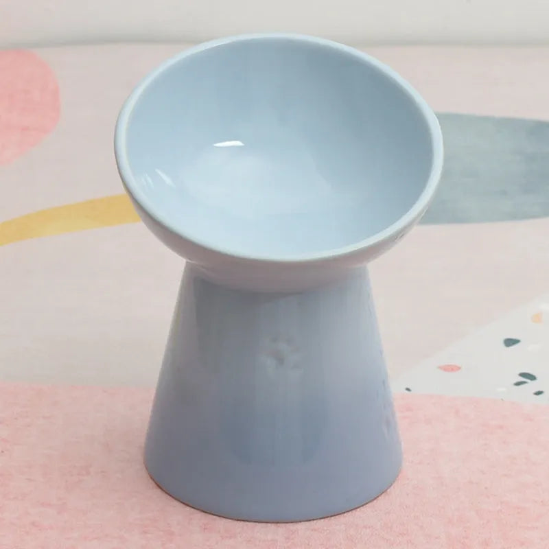 Ceramic pet bowl with anti-tumble design and raised chin support for cats and dogs
