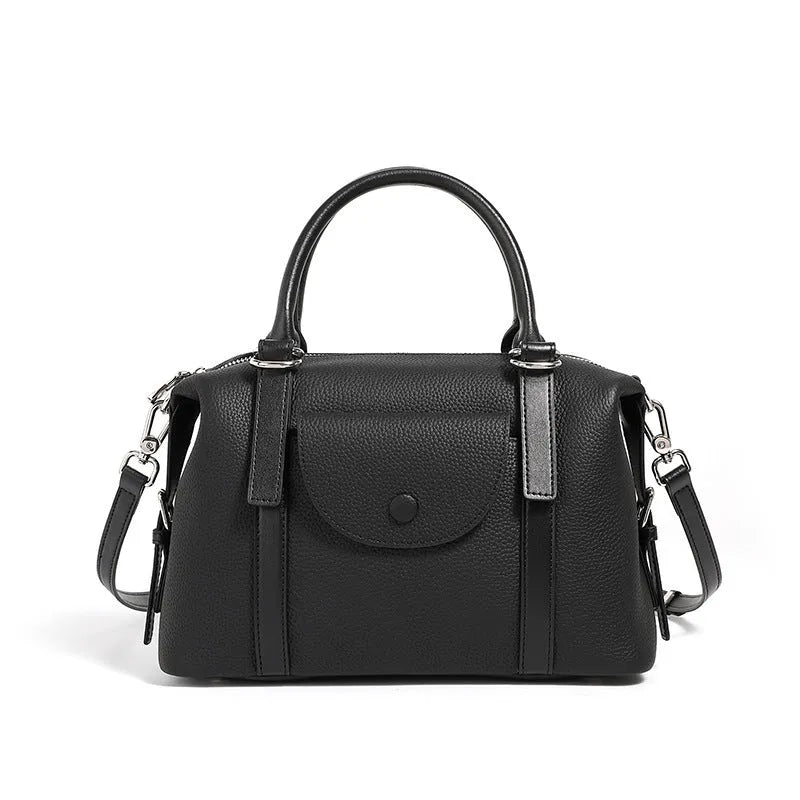 Genuine leather ladies handbag in black, brown, or elephant grey with contrast stitching and a lock.