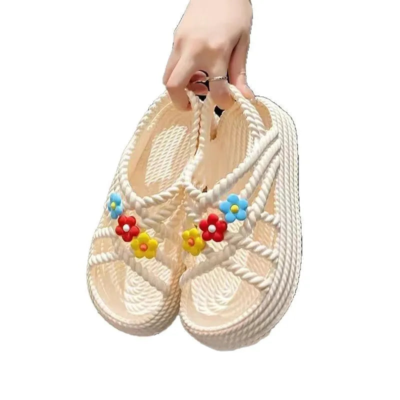 Women's floral decorated PVC sandals in beige or black with non-slip soles