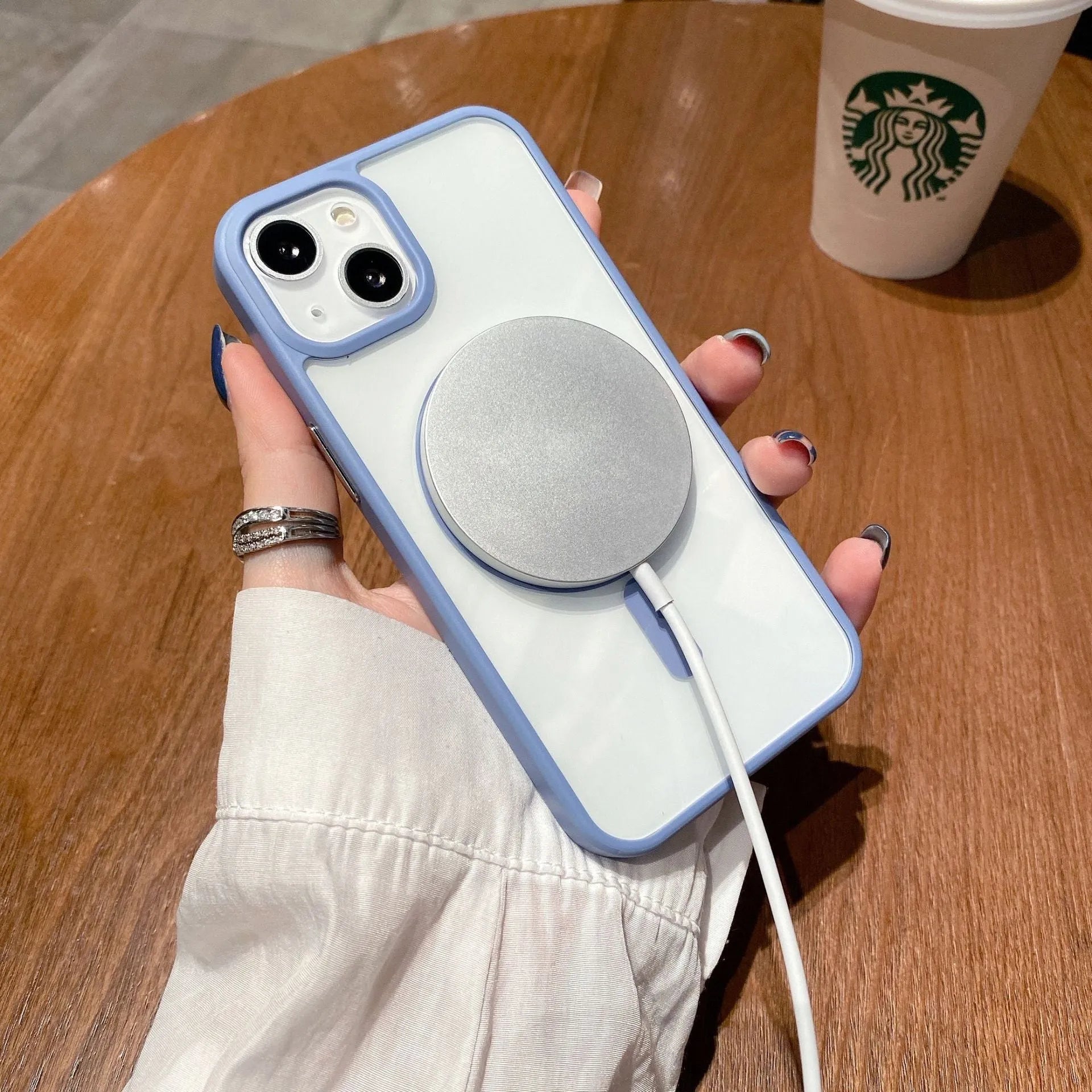 Transparent acrylic MagSafe phone case for iPhone showing magnetic ring and clear design