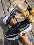 Women's Flyknit mesh lace-up sneakers in multiple colours on a rubber sole.