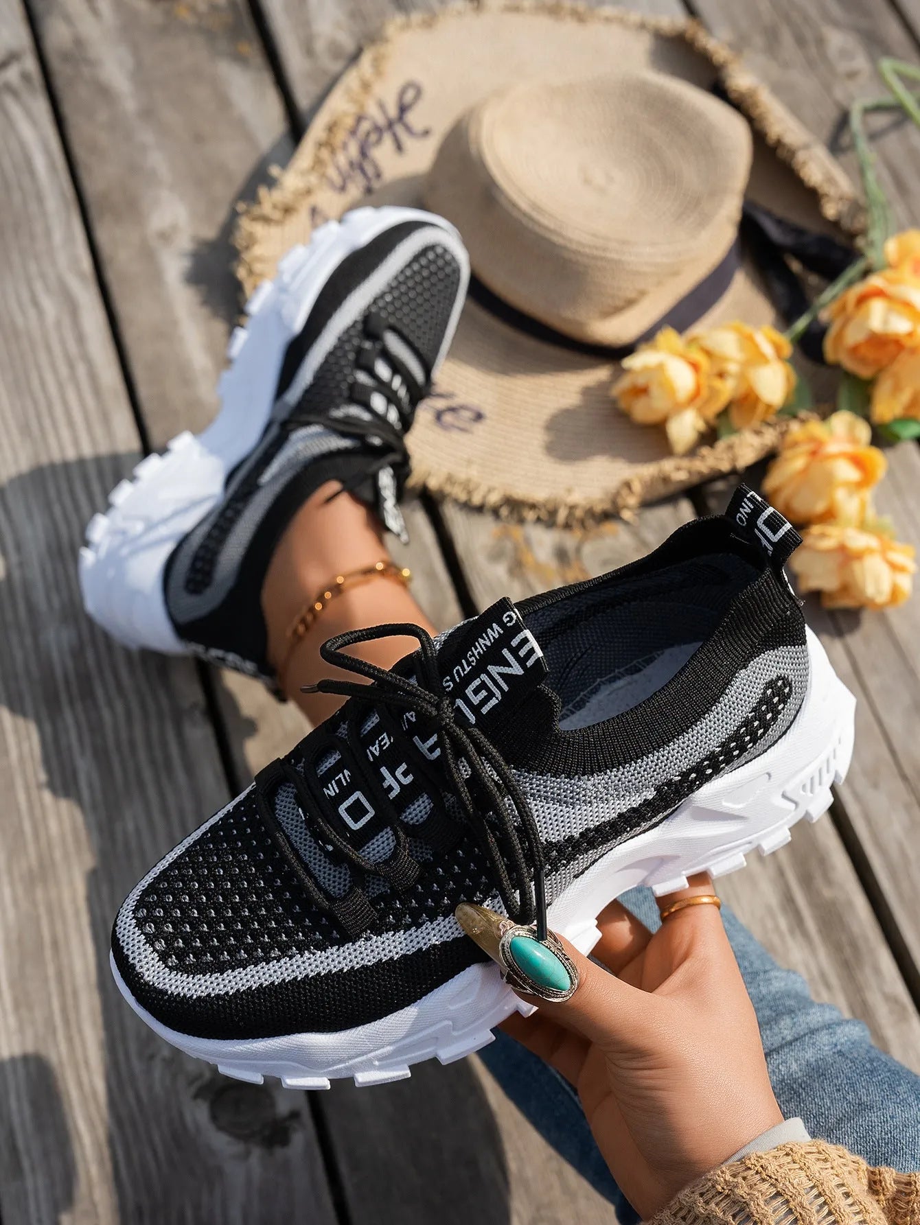 Women's Flyknit mesh lace-up sneakers in multiple colours on a rubber sole.
