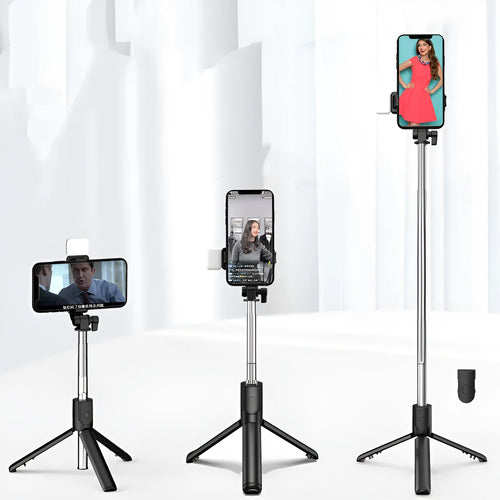 Black aluminium alloy Bluetooth selfie stick with extended tripod legs and a phone attached to the 360-degree rotating holder.