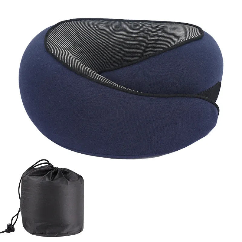U-shaped memory foam travel neck pillow in a storage bag, shown in dark grey colour.