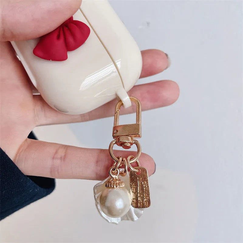 Beige red bow shell patterned TPU protective case for AirPods Pro and other models.