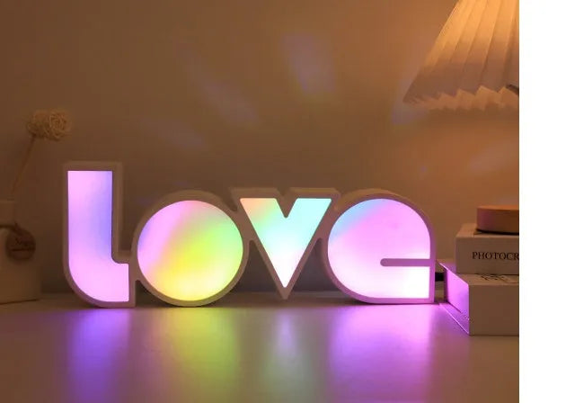 Rainbow style LED LOVE light decoration with plastic shell measuring 35.5cm by 13.5cm