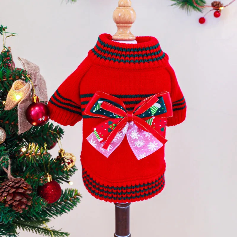 Red and green dog Christmas jumpers on a size chart showing XS, S, M, L, XL for pet weights 1kg to 9kg