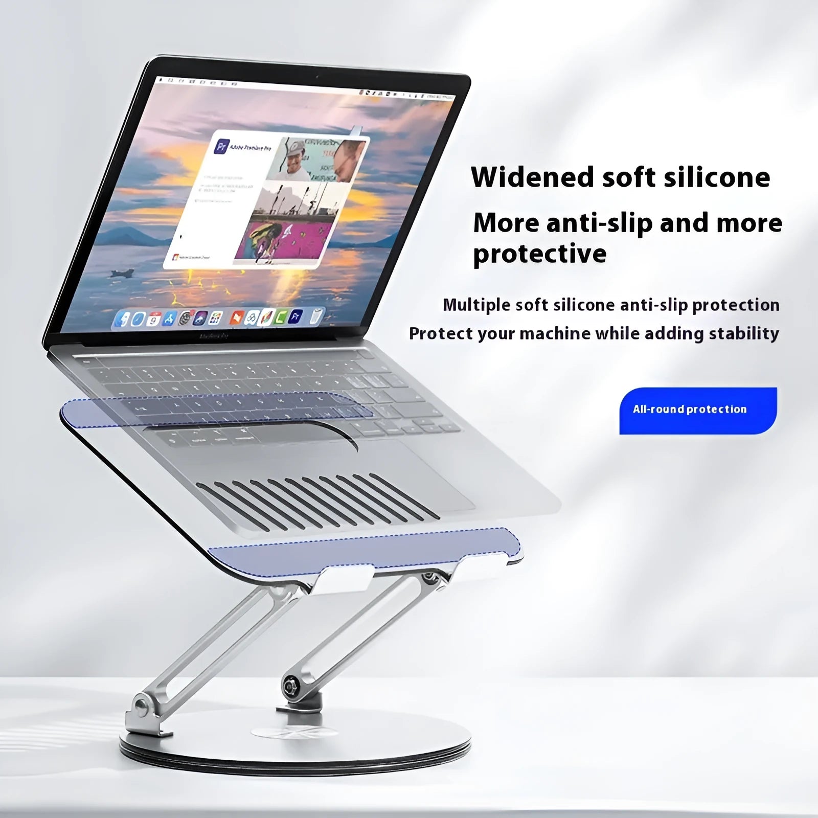 Silver aluminium alloy laptop stand with adjustable height and rotatable design on wooden desk