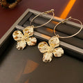 Silver Needle metal flower earrings in geometric design with electroplated gold or silver finish
