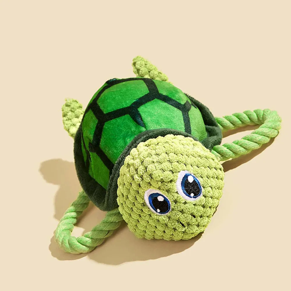 Turtle shaped dog chewing toy with rope knot legs and natural rubber shell in grey, green or orange