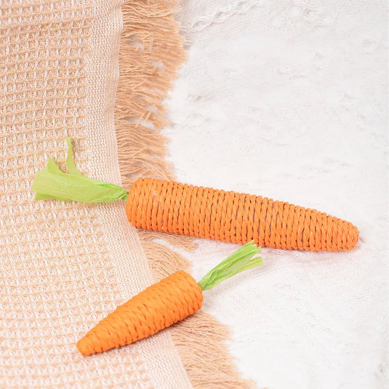Cat toys with paper carrot shapes containing ringing stones for dental care and interactive play