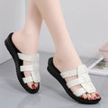 Beige women's flat-bottom slippers with a PU leather toe and soft sole.