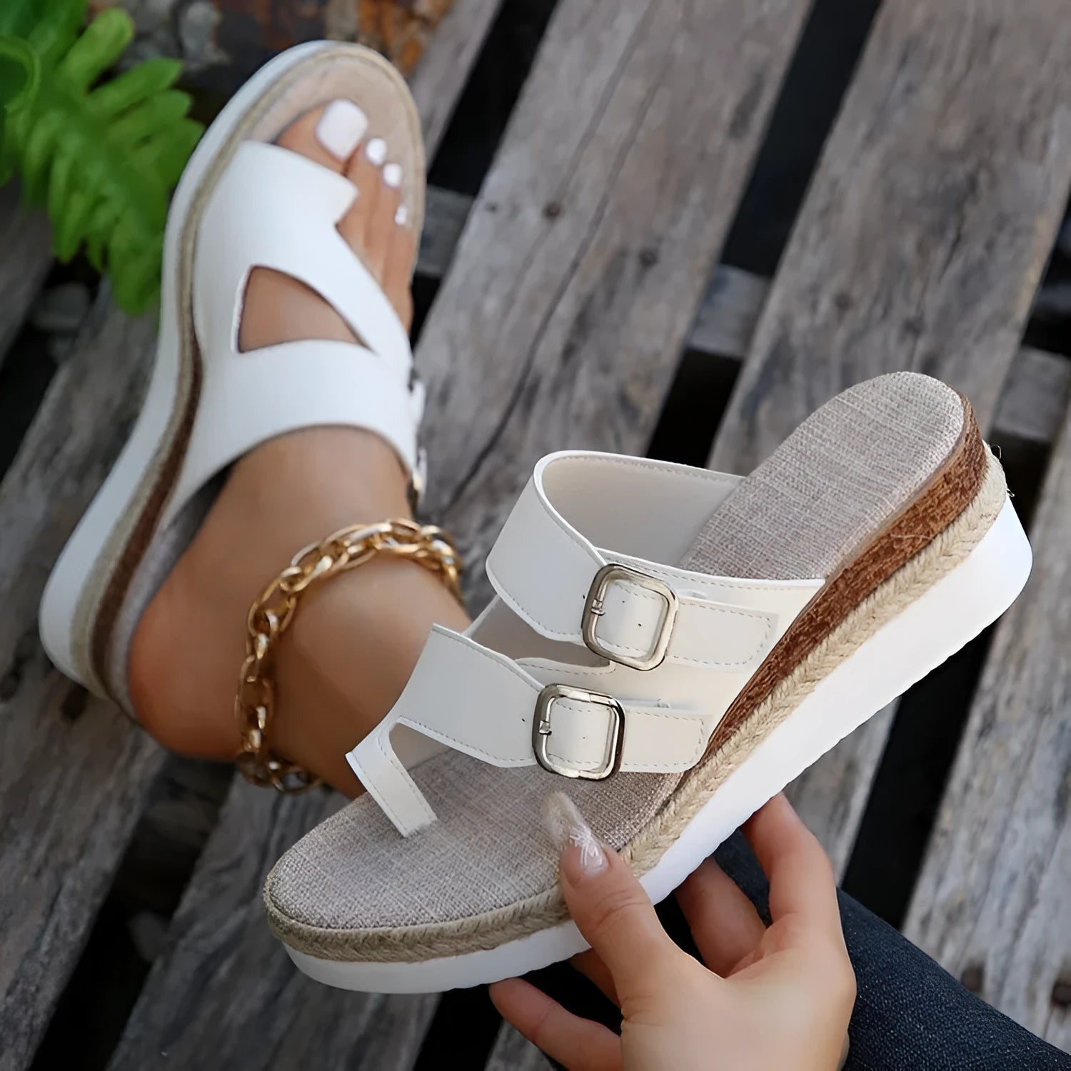 White patent leather women's sandals with wedge heel and woven finger-fit straps in peep toe design
