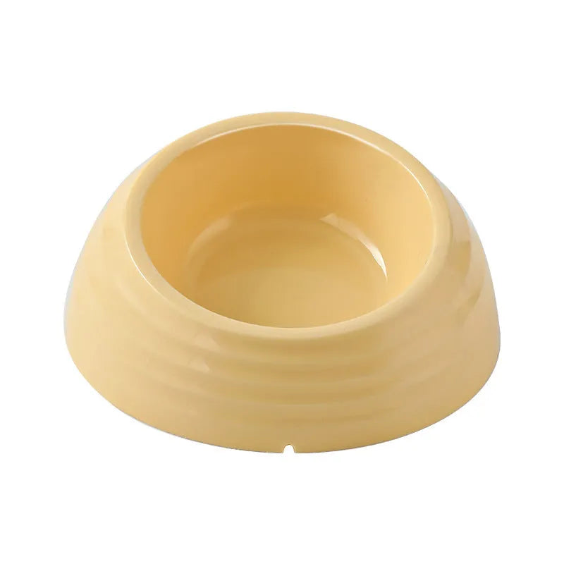 Stainless steel cat bowl on a plastic base in beige, brown, or light green.