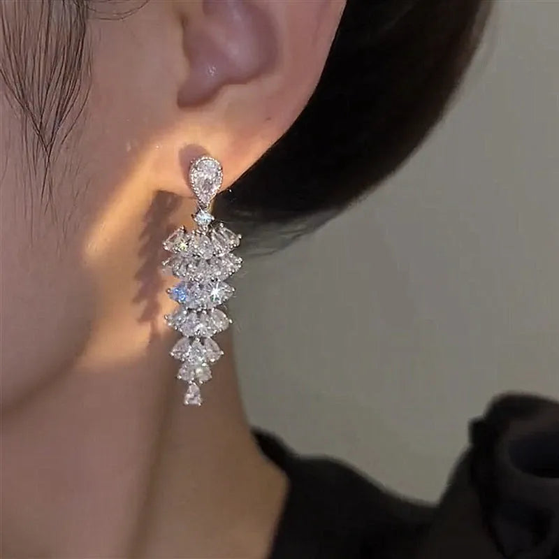 Silver pagoda colour Christmas tree drop earrings with sparkling zircon details on copper studs.