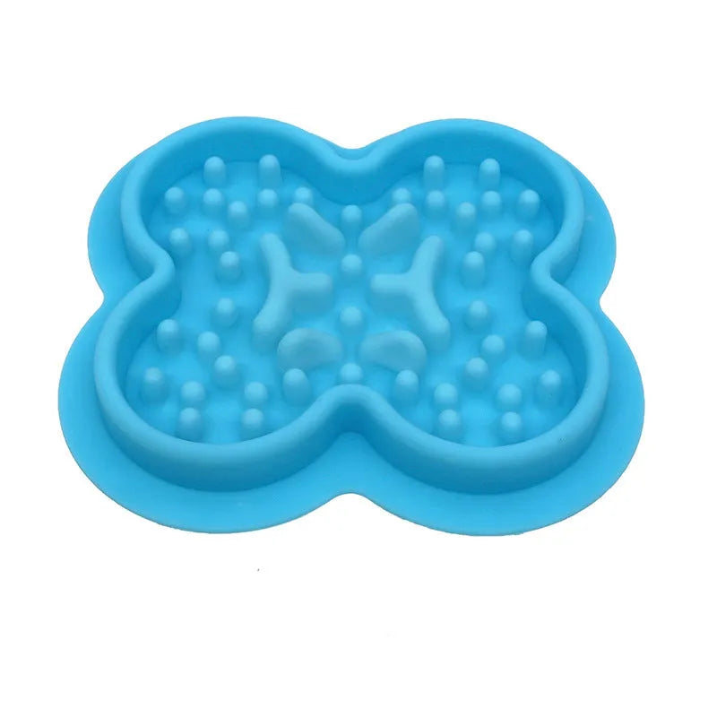 Silicone pet slow feeder licking mat in green colour with textured surface and non-slip base.