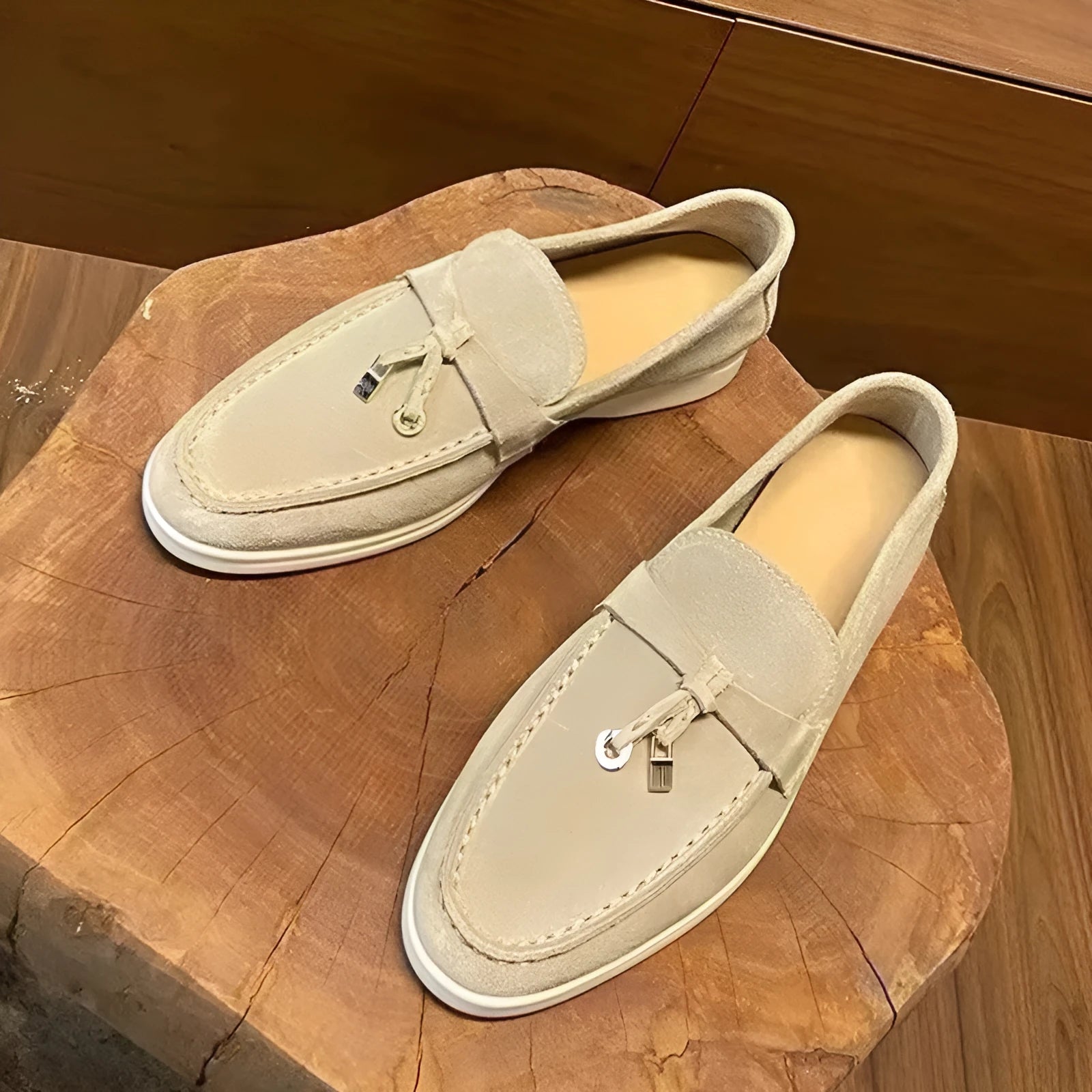 Gommino style high-top slip-on loafers in black with rubber sole and round steel toe.