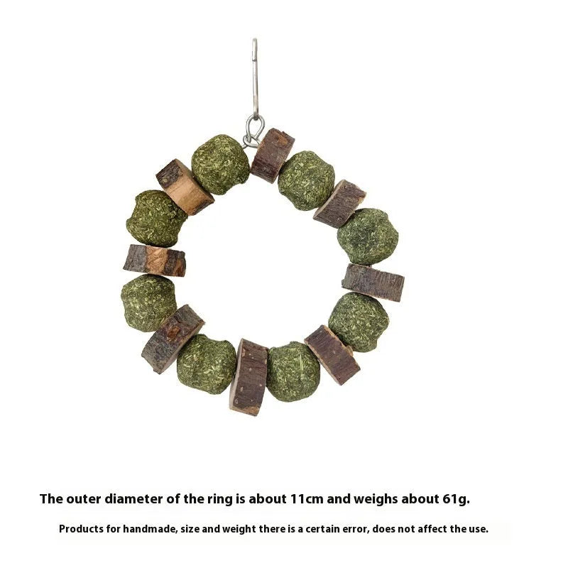 Applewood and woven straw ball chew ring toy for small pets on a white background.