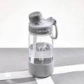 A grey heat-resistant plastic portable cup with a cylindrical shape on a plain background.