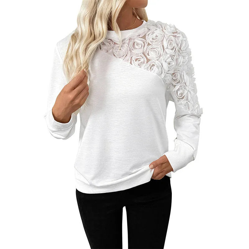 White long sleeve pullover top with flower pattern and regular sleeves in loose fit