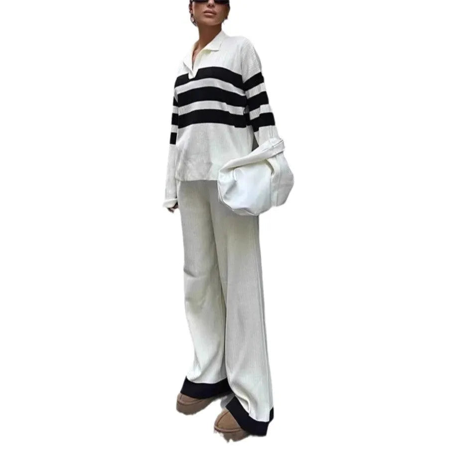 Women's black knitted two-piece set with polo collar shirt and striped matching trousers