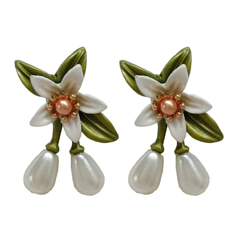 Sterling silver needle camellia earrings with flower ear clip design and contrast colour detailing