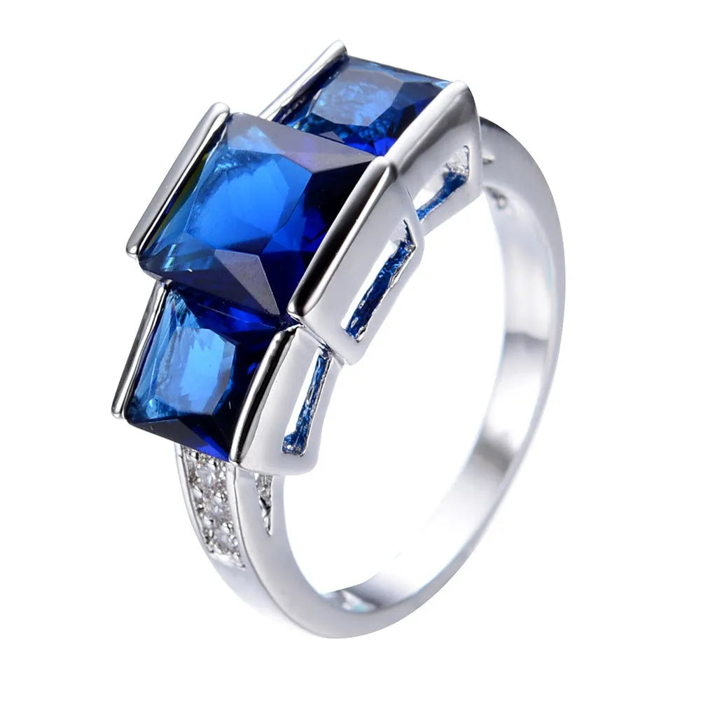 Women's geometric rainbow metal ring in electroplated copper showing colour options.