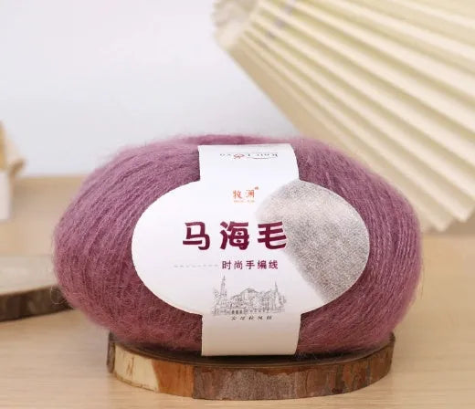 Single ball of mohair yarn in various colours for hand-woven DIY scarf knitting projects