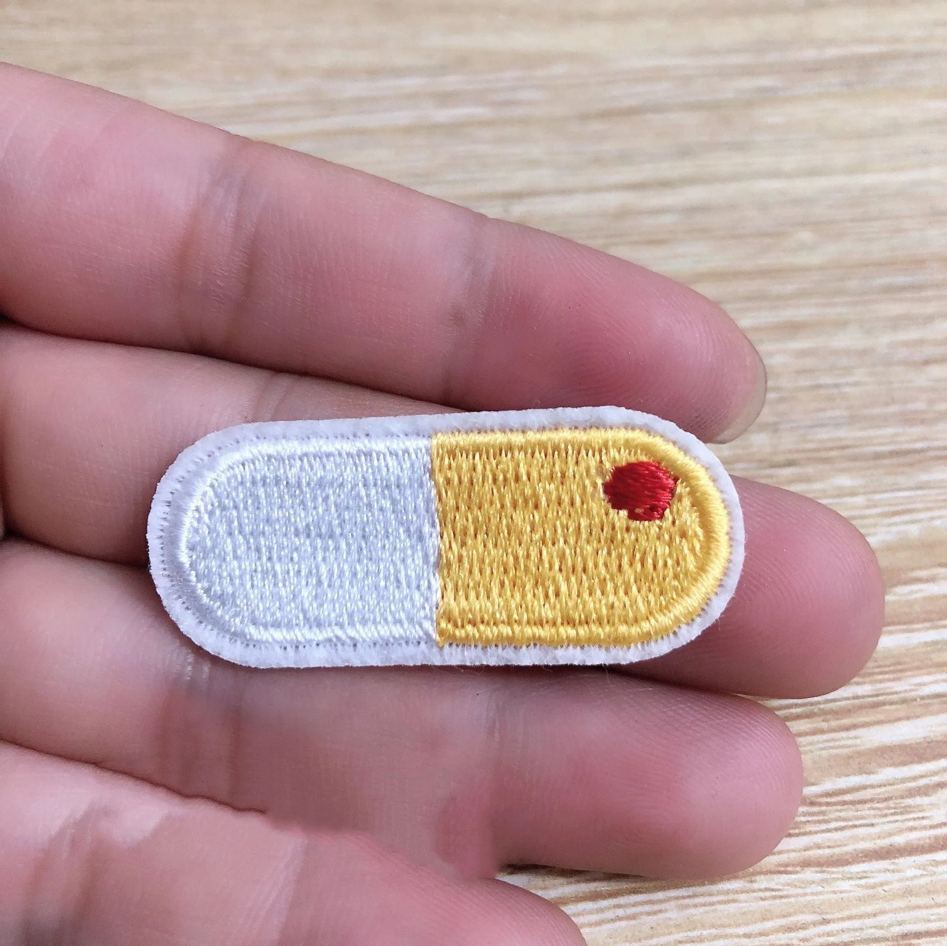 Ten computer embroidered fabric patches with detailed raised designs for clothing decoration