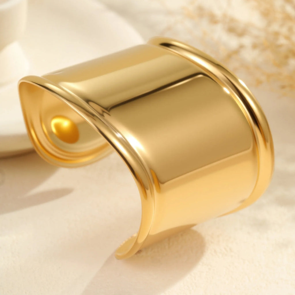 Women's 18K gold plated stainless steel bracelet with exaggerated wide wave geometric design