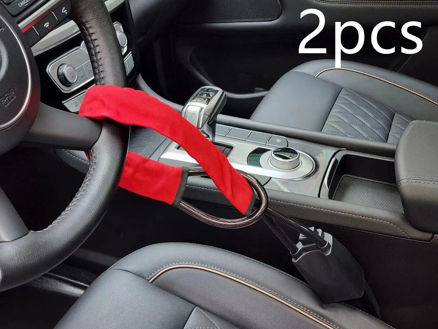 Red iron steering wheel lock with wire rope for a General Motors car.