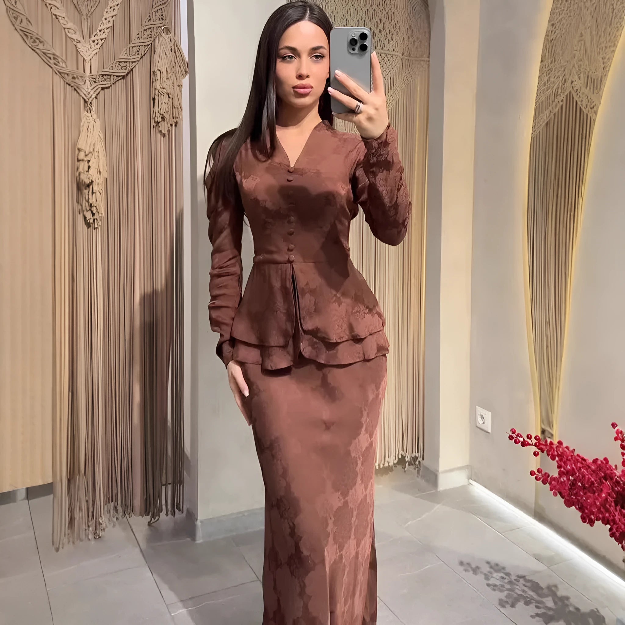 Dark brown artistic retro long sleeve pullover dress with plant pattern and button detail.