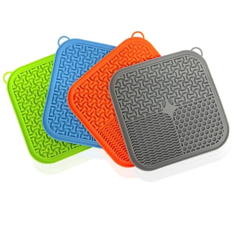 Blue silicone dog licking mat with textured pattern and suction cups on back