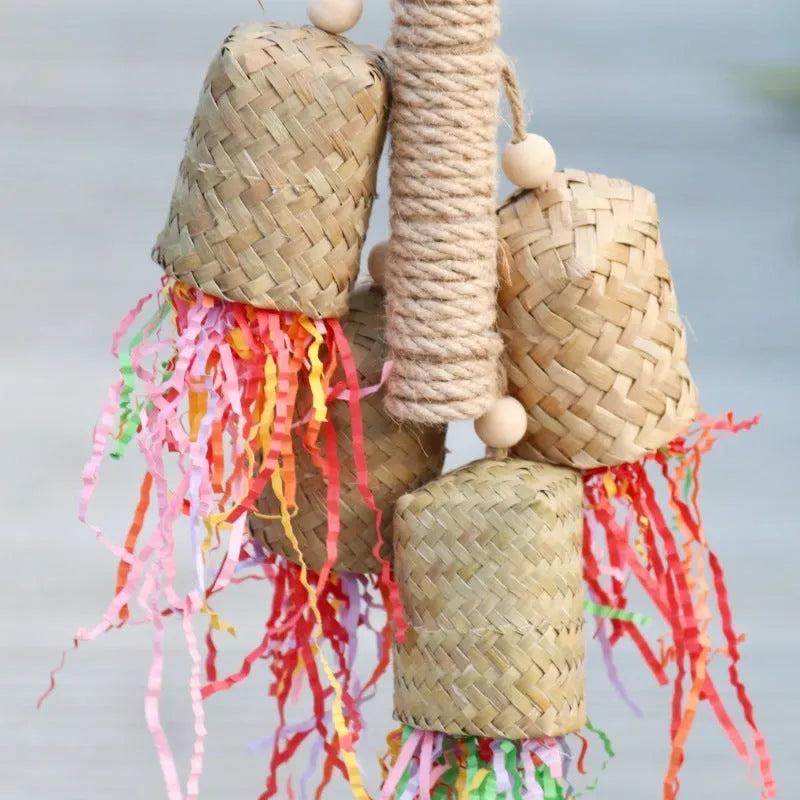 Colourful shredded paper parrot toy made of wood and sisal rope, measuring 35cm long.