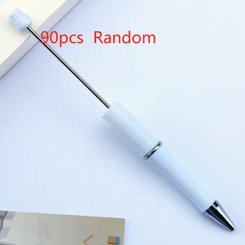 Creative ballpoint pen with multicoloured spinning plastic beads on a steel wire frame.
