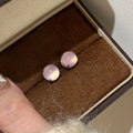 Round geometric chalcedony earrings with four-claw settings in three colour variations