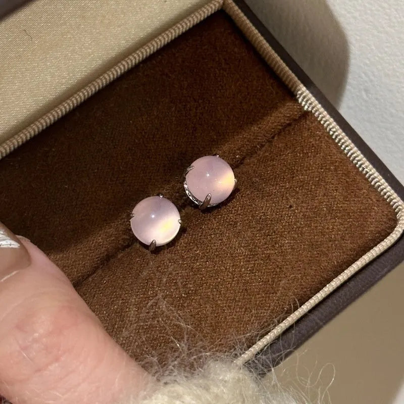 Round geometric chalcedony earrings with four-claw settings in three colour variations