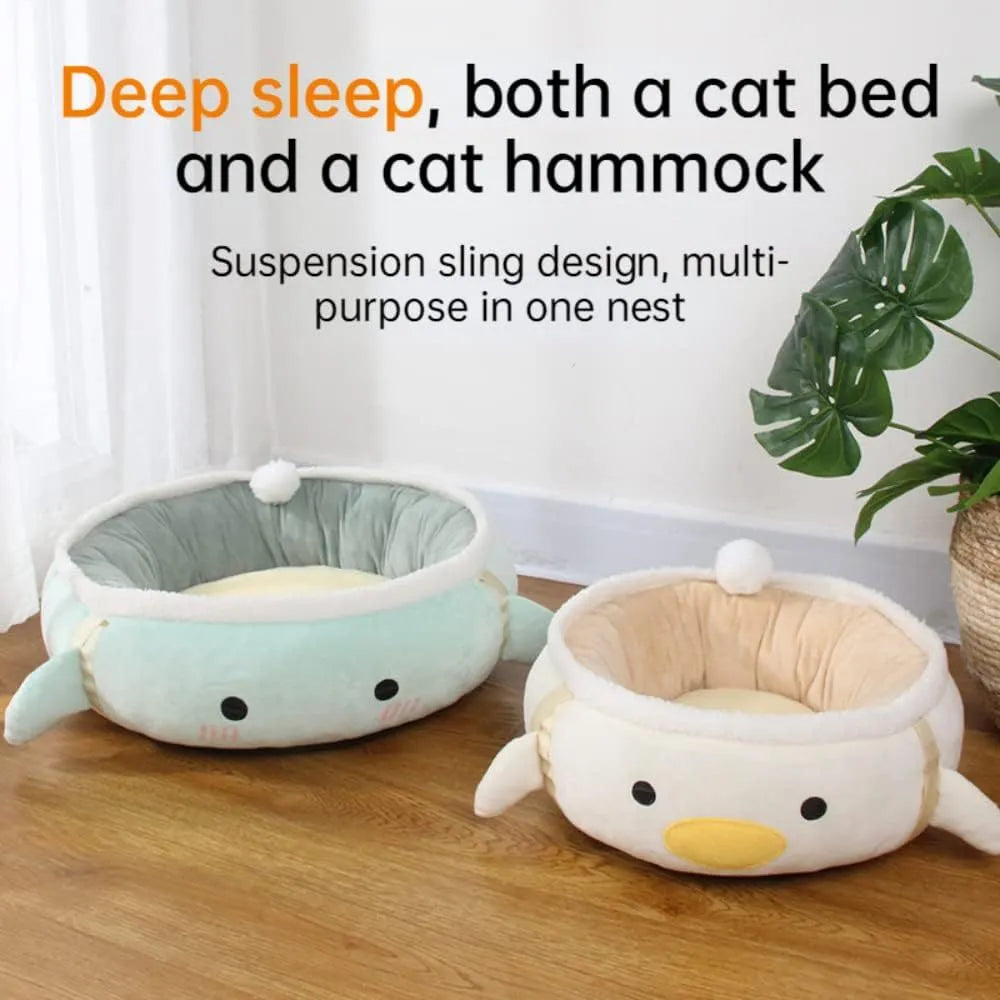 Green dinosaur-shaped cat bed with hanging straps that can be used flat or as a hammock