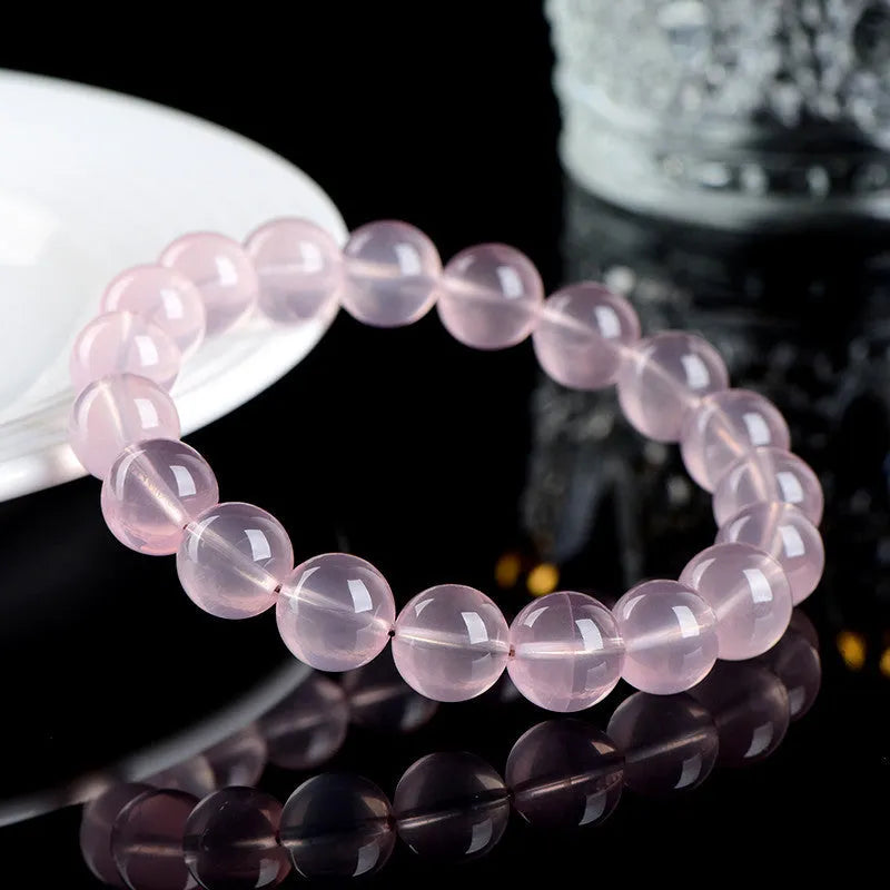 Natural starlight crystal round bead bracelet for women in polished pink with single circle construction