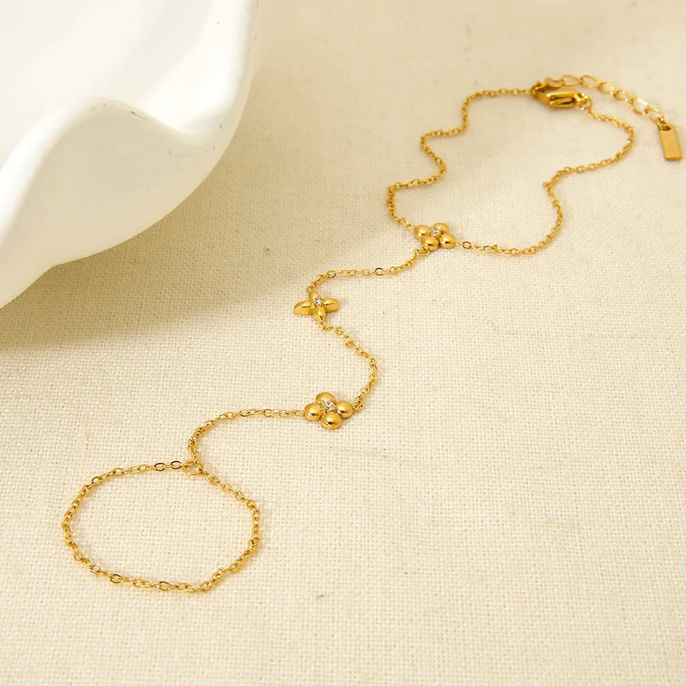 Gold stainless steel bracelet with geometric flower and octagonal star design