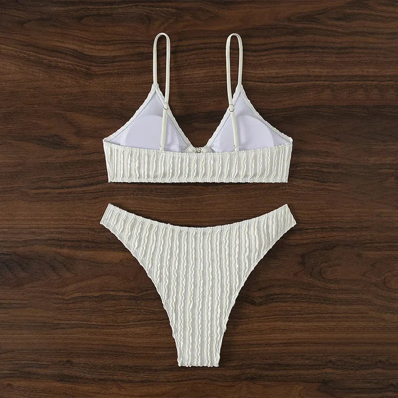 White women's V-neck swimsuit with split leg design and two-piece construction