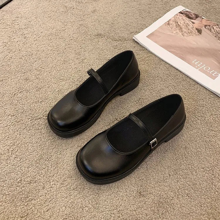 Women's solid colour flat heel loafers in red, black, or greyish black.