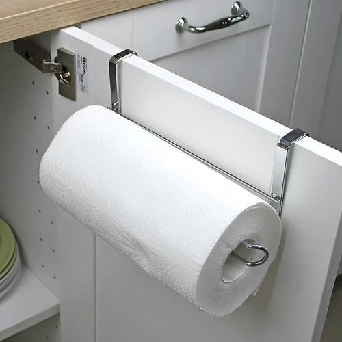 Silver stainless steel paper towel rack mounted on kitchen cabinet door
