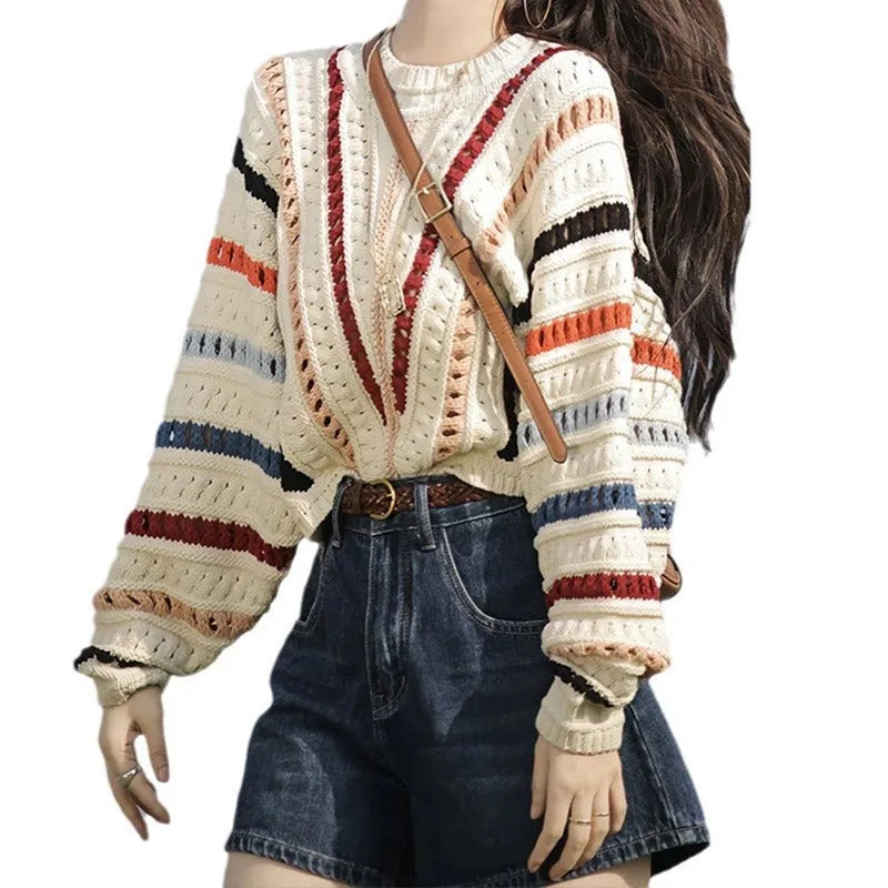 Colourful retro rainbow striped loose sweater with batwing sleeves on a hanger