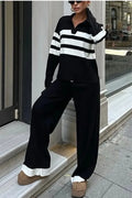 Women's black knitted two-piece set with polo collar shirt and striped matching trousers