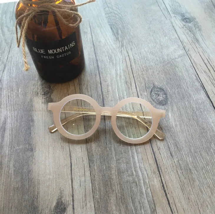 Retro round plastic frame glasses with anti-blue light filter in black, pink, leopard, red, white, or yellow.