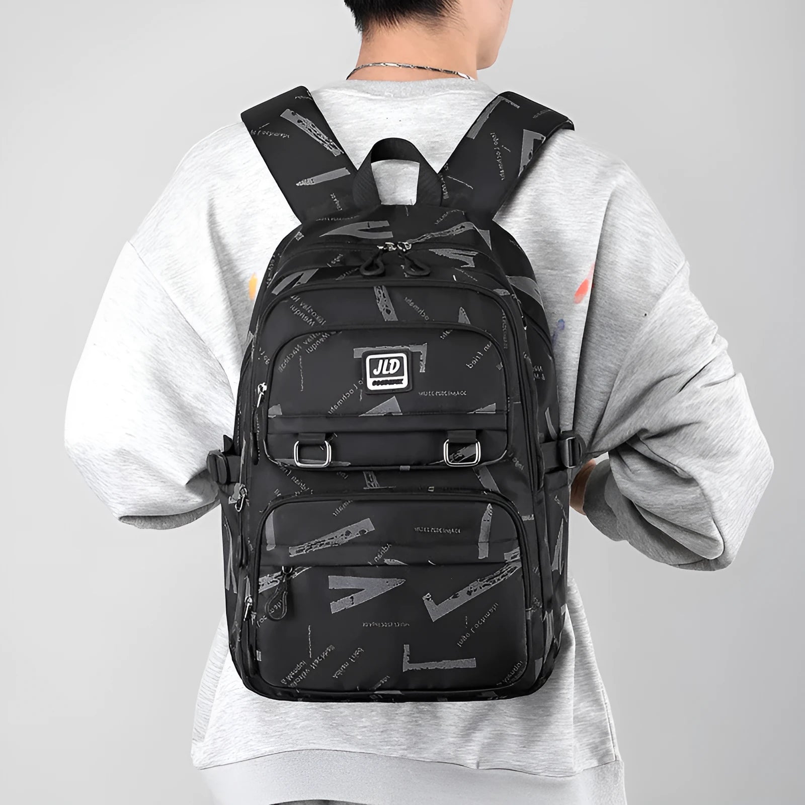 Large purple girls' nylon school backpack with a physiological curve backpanel on a white background.